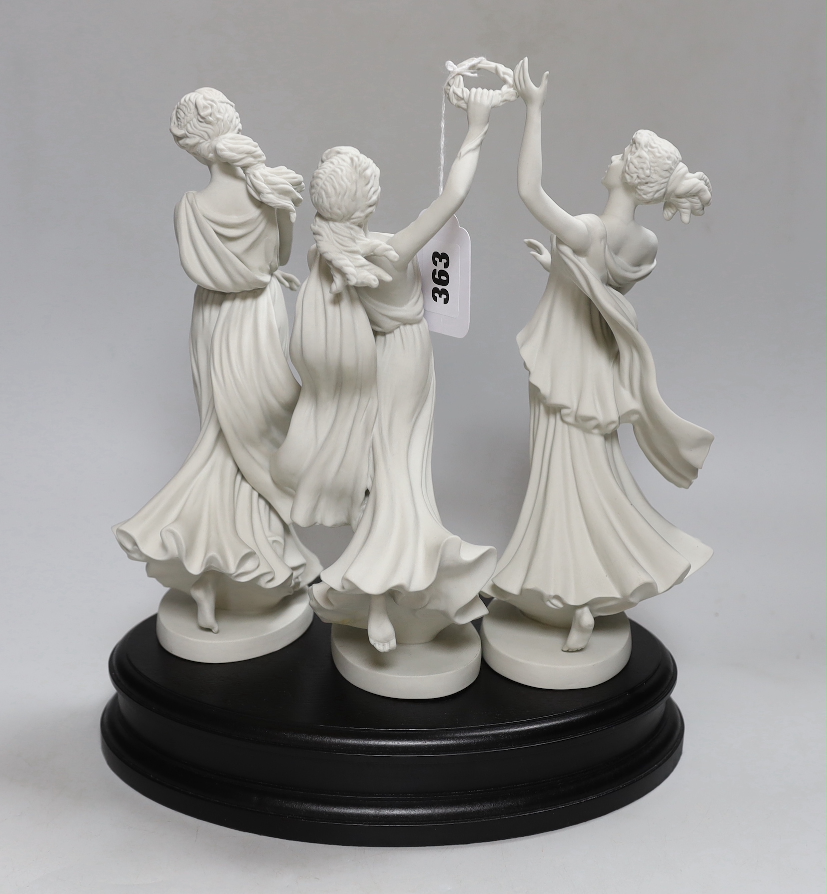 Wedgwood for Compton and Woodhouse, the three graces, raised on an oval stand, each numbered 365 to the base, 29cm high